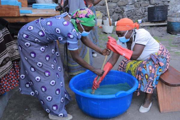 Members of the community preparing the soap 