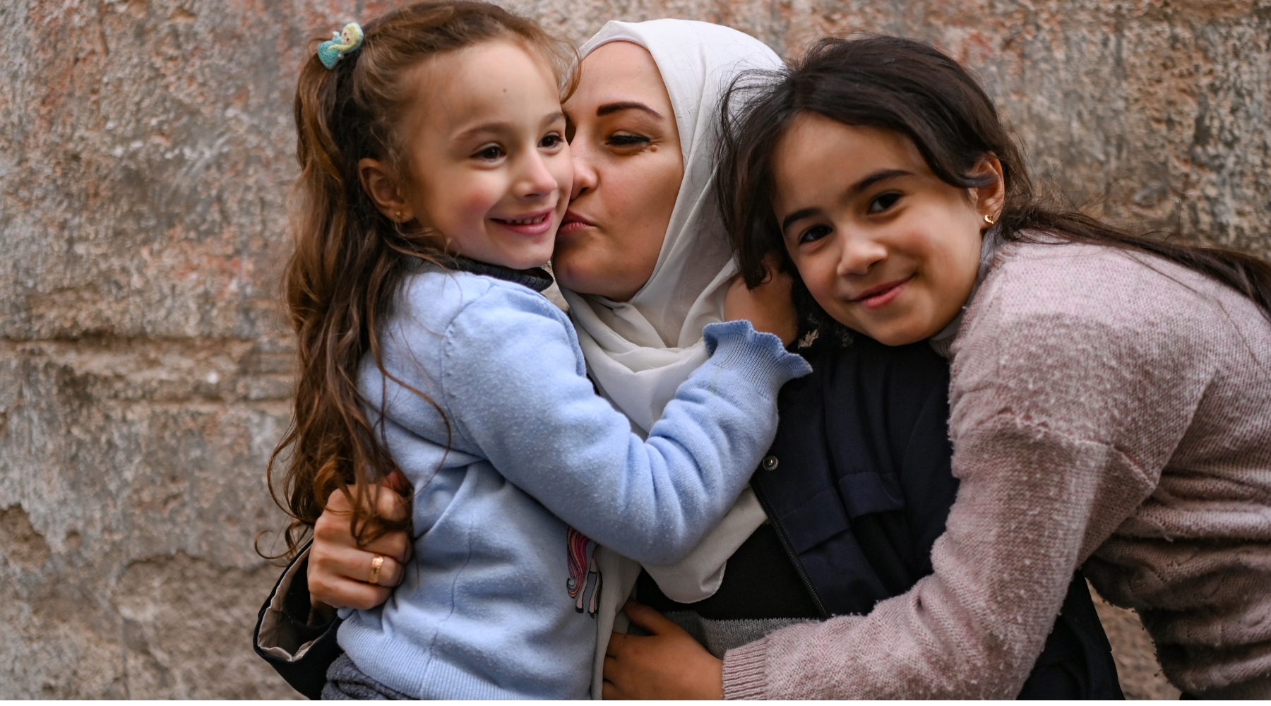 Khulod, the HR manager at Kareemat, an ActionAid partner in Türkiye, pictured here with her daughters.